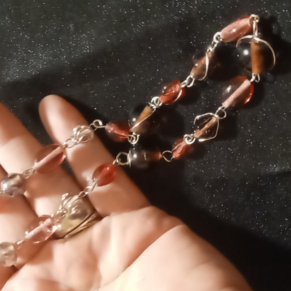 Glass Beaded Necklace with pink , brown with Silver Accents. 18 in long